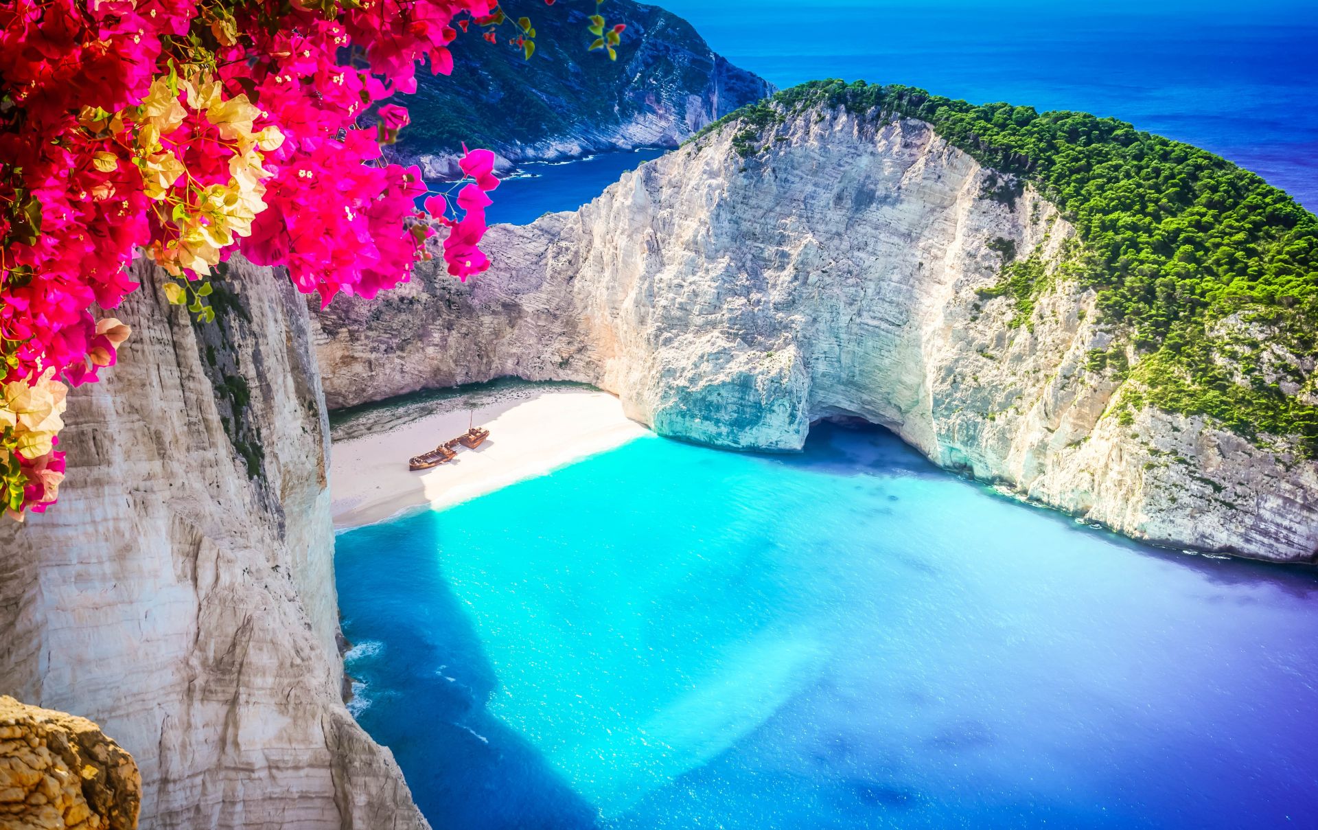 Navagio beach, famous aerial Zakinthos island with flowers, Greece