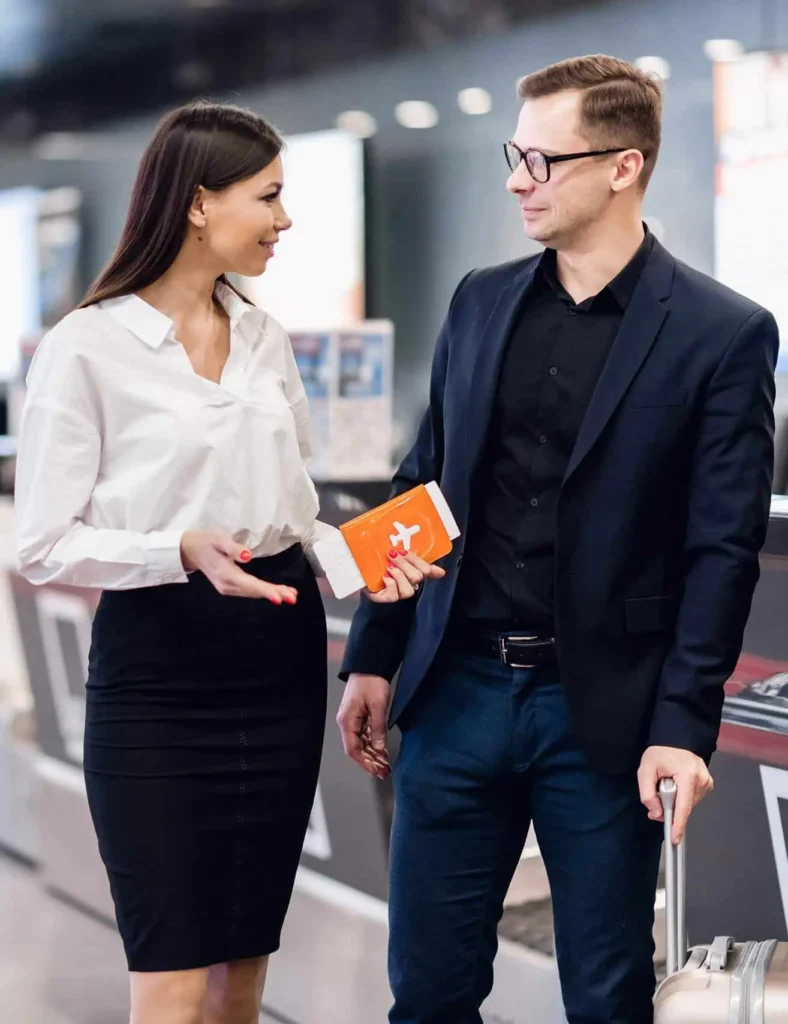 Airport assistance desk with staff helping travelers