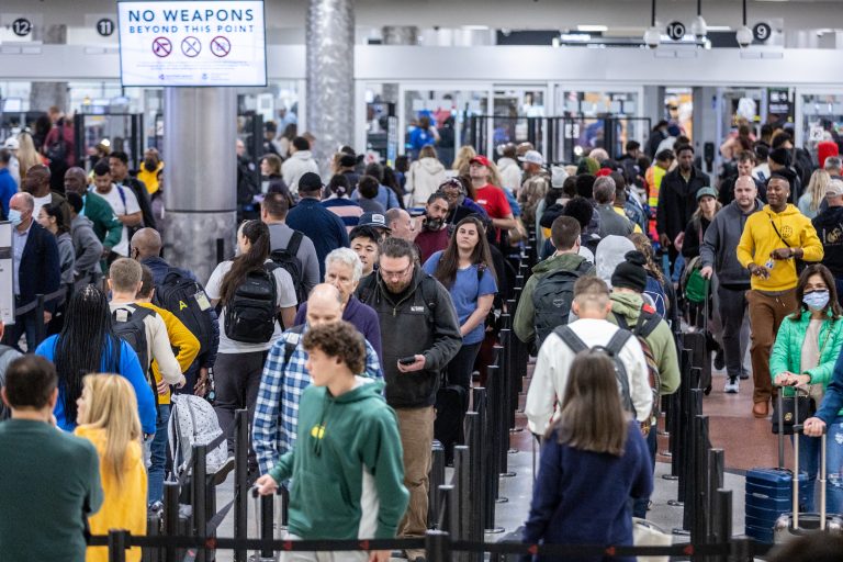 crowded airport caused by flight delays